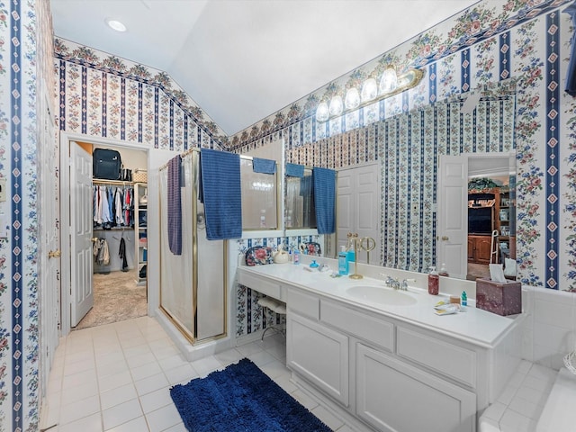 13410 Spyglen Ct, Cypress, TX 77429 - bathroom with vaulted ceiling, wallpapered walls, a stall shower, vanity, and tile patterned flooring
