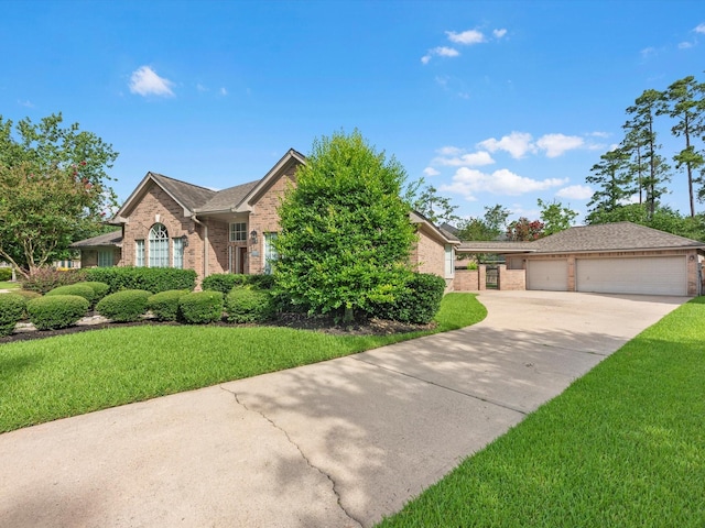 13410 Spyglen Ct, Cypress, TX 77429 - view of front of home with brick siding, a front lawn, a detached garage, and driveway
