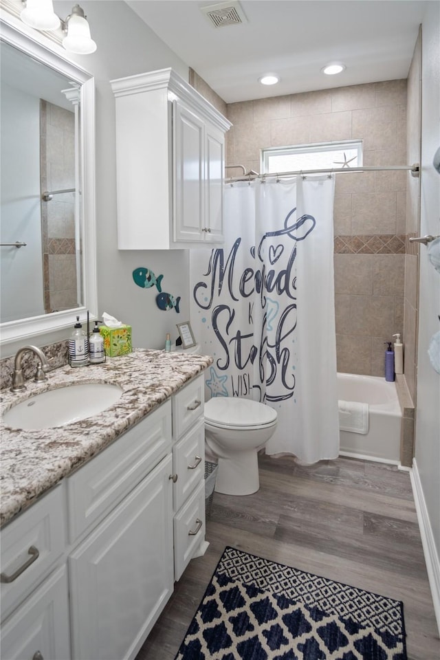 956 Biscayne, Crystal Beach, TX 77650 - full bath featuring vanity, wood finished floors, and shower / tub combo