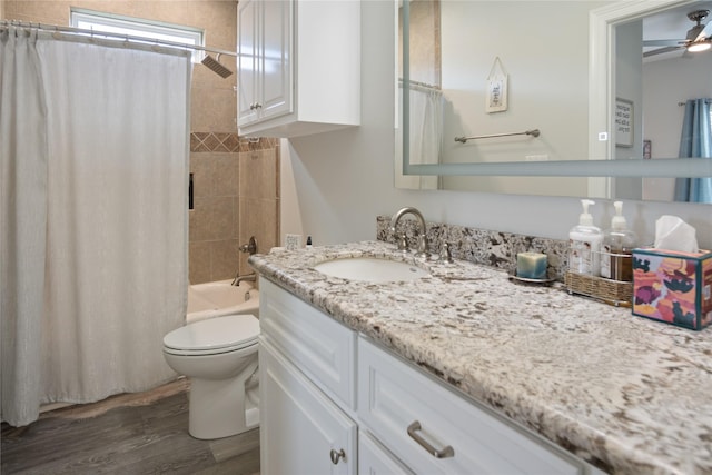 956 Biscayne, Crystal Beach, TX 77650 - bathroom with vanity, wood finished floors, a ceiling fan, and shower / bathtub combination with curtain