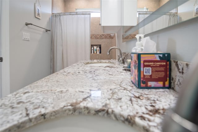 956 Biscayne, Crystal Beach, TX 77650 - kitchen featuring white cabinetry and light stone counters