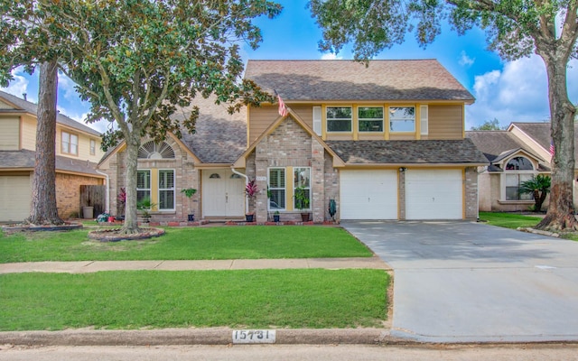 15731 Oak Mountain Dr, Houston, TX 77095 - view of front of property with concrete driveway, a front lawn, a garage, brick siding, and roof with shingles