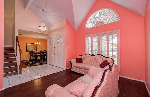 15731 Oak Mountain Dr, Houston, TX 77095 - living room with wood-type flooring, a chandelier, stairway, and high vaulted ceiling