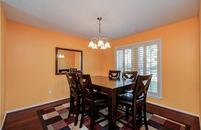 15731 Oak Mountain Dr, Houston, TX 77095 - dining area featuring healthy amount of natural light, wood finished floors, and a chandelier