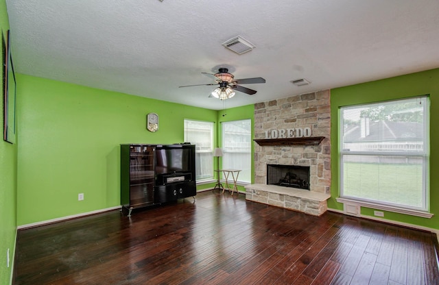 15731 Oak Mountain Dr, Houston, TX 77095 - unfurnished living room with ceiling fan, wood-type flooring, and a fireplace
