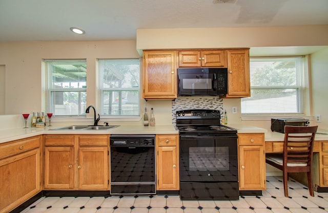 15731 Oak Mountain Dr, Houston, TX 77095 - kitchen featuring black appliances, plenty of natural light, light floors, light countertops, and recessed lighting