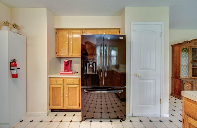 15731 Oak Mountain Dr, Houston, TX 77095 - kitchen featuring black fridge, light floors, and light countertops