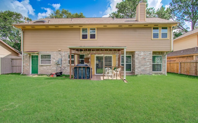 15731 Oak Mountain Dr, Houston, TX 77095 - back of property featuring a fenced backyard, a chimney, brick siding, and a patio