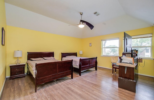 15731 Oak Mountain Dr, Houston, TX 77095 - bedroom with vaulted ceiling, wood finished floors, and ceiling fan