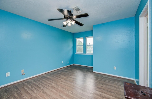 15731 Oak Mountain Dr, Houston, TX 77095 - unfurnished room with wood finished floors, ceiling fan, and a textured ceiling
