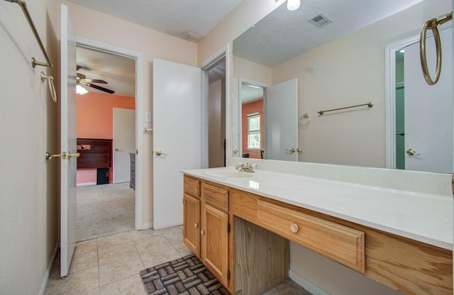 15731 Oak Mountain Dr, Houston, TX 77095 - bathroom featuring vanity, tile patterned flooring, and ceiling fan