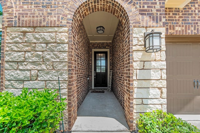 2922 Muhley St, Katy, TX 77493 - view of exterior entry featuring brick siding and stone siding