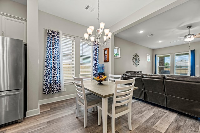2922 Muhley St, Katy, TX 77493 - dining room with a ceiling fan, light wood-style flooring, a chandelier, and recessed lighting