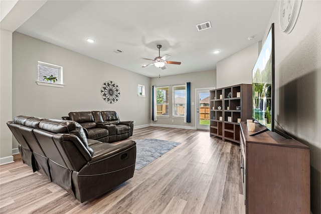 2922 Muhley St, Katy, TX 77493 - living area featuring light wood-style floors, a ceiling fan, and recessed lighting