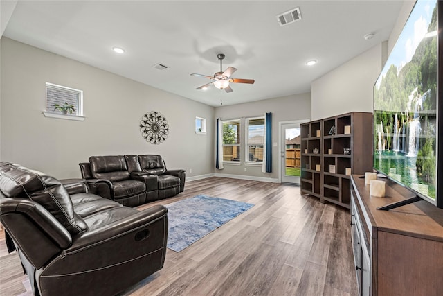 2922 Muhley St, Katy, TX 77493 - living area featuring wood finished floors, a ceiling fan, and recessed lighting