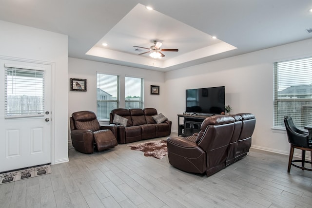 8023 Royal Palm Dr, Fulshear, TX 77441 - living area featuring a ceiling fan, light wood-style floors, a raised ceiling, and recessed lighting