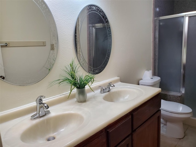 9206 Beringwood Dr, Houston, TX 77083 - full bath featuring double vanity, a shower with shower door, and tile patterned floors