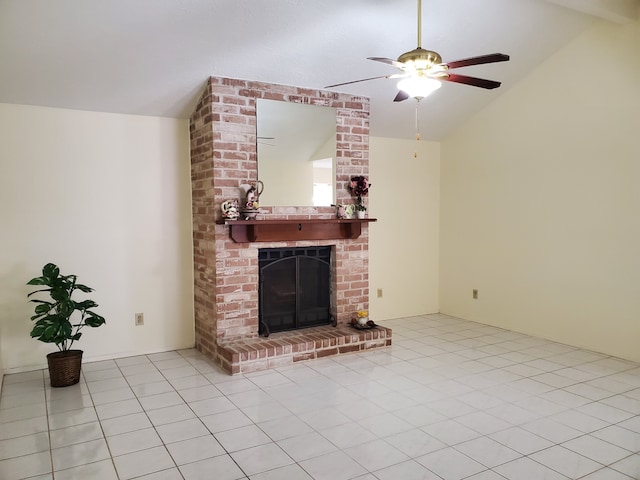9206 Beringwood Dr, Houston, TX 77083 - unfurnished living room with vaulted ceiling, ceiling fan, tile patterned floors, and a brick fireplace