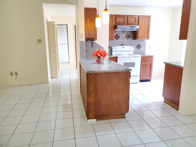 9206 Beringwood Dr, Houston, TX 77083 - kitchen featuring white range with electric stovetop, under cabinet range hood, tasteful backsplash, a peninsula, and light stone counters