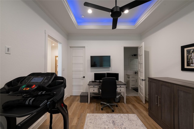 14646 Whistling Oak Dr, Conroe, TX 77356 - office with a tray ceiling, light wood finished floors, crown molding, and ceiling fan