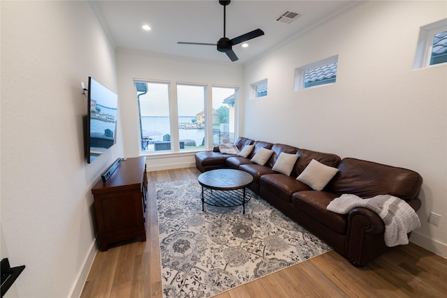 14646 Whistling Oak Dr, Conroe, TX 77356 - living room with a ceiling fan, ornamental molding, light wood finished floors, and recessed lighting