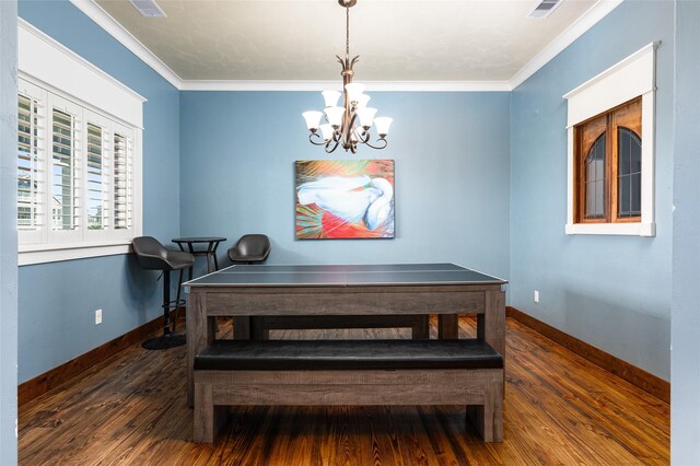 973 Kenlyn Dr, Crystal Beach, TX 77650 - dining area with a chandelier, wood finished floors, and ornamental molding
