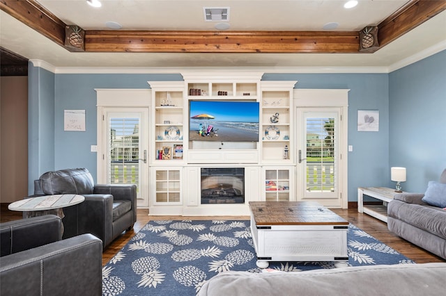973 Kenlyn Dr, Crystal Beach, TX 77650 - living area with wood finished floors, crown molding, a raised ceiling, a fireplace, and recessed lighting