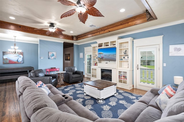973 Kenlyn Dr, Crystal Beach, TX 77650 - living area featuring ceiling fan, a tray ceiling, crown molding, a fireplace, and wood finished floors