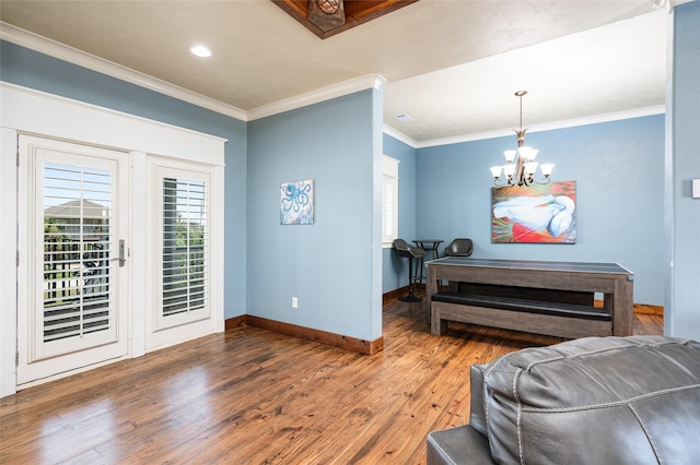 973 Kenlyn Dr, Crystal Beach, TX 77650 - entrance foyer with hardwood / wood-style floors, crown molding, a chandelier, and recessed lighting