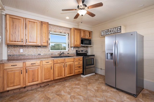 973 Kenlyn Dr, Crystal Beach, TX 77650 - kitchen featuring appliances with stainless steel finishes, a ceiling fan, and backsplash