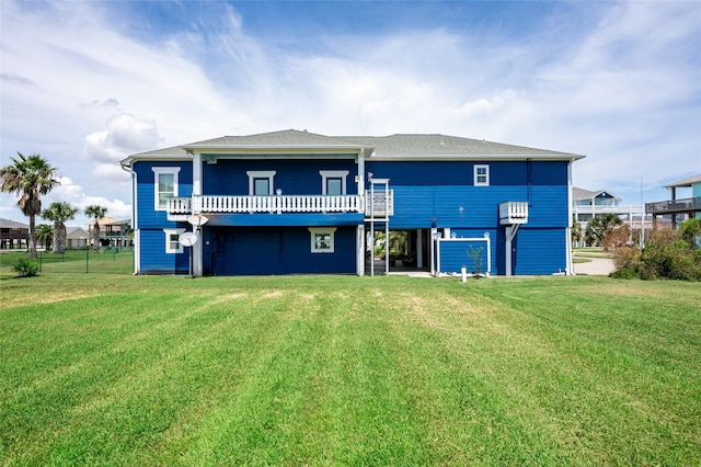 973 Kenlyn Dr, Crystal Beach, TX 77650 - rear view of house with a lawn and a wooden deck