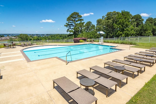 11526 Gingerland Dr, Conroe, TX 77304 - community pool with a patio area and view of wooded area