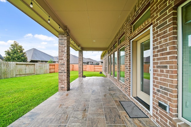 1303 Paradise Creek Ln, Rosenberg, TX 77471 - fenced backyard featuring a patio