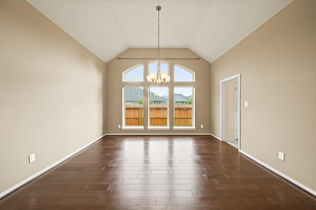 1303 Paradise Creek Ln, Rosenberg, TX 77471 - unfurnished dining area featuring a chandelier, dark wood-type flooring, and high vaulted ceiling