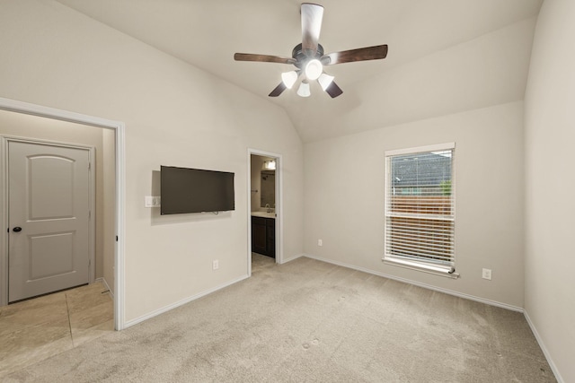 1303 Paradise Creek Ln, Rosenberg, TX 77471 - unfurnished bedroom featuring light carpet, lofted ceiling, ensuite bath, and ceiling fan