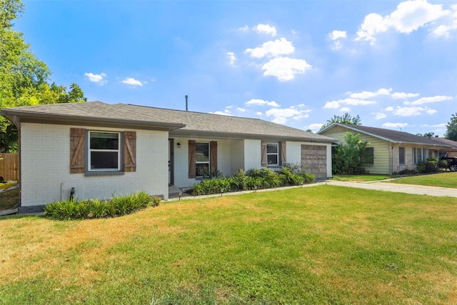 510 Jerry St, Houston, TX 77022 - ranch-style home with brick siding, an attached garage, driveway, and a front yard