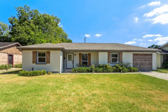 510 Jerry St, Houston, TX 77022 - single story home with a garage, a front yard, brick siding, and concrete driveway
