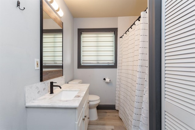 510 Jerry St, Houston, TX 77022 - full bathroom featuring vanity, wood finished floors, and a shower with curtain