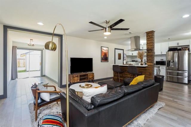 510 Jerry St, Houston, TX 77022 - living room with light wood finished floors, ceiling fan, and recessed lighting