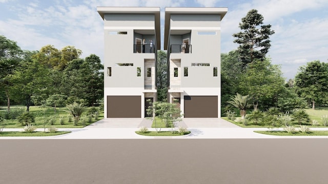 1804 65th St Unit A, Galveston, TX 77551 - view of front facade with stucco siding, driveway, and an attached garage