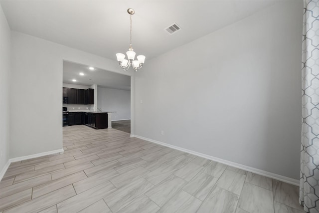 11103 Larkspur Dale Ct, Houston, TX 77044 - empty room with a chandelier and baseboards
