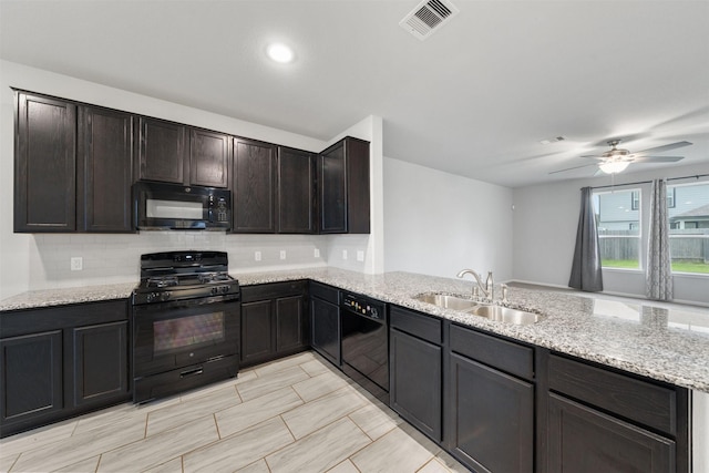 11103 Larkspur Dale Ct, Houston, TX 77044 - kitchen featuring black appliances, a peninsula, light stone counters, backsplash, and a ceiling fan