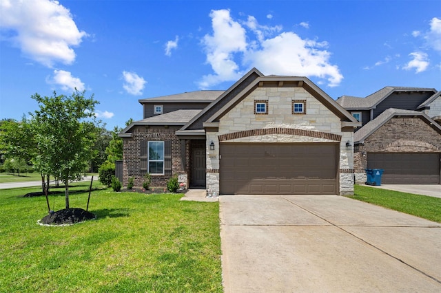 11103 Larkspur Dale Ct, Houston, TX 77044 - view of front of house with driveway, a front yard, stone siding, an attached garage, and brick siding