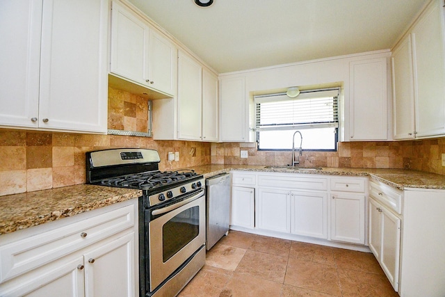 4114 Lemac Dr, Houston, TX 77025 - kitchen with stainless steel appliances, white cabinets, light stone countertops, and tasteful backsplash