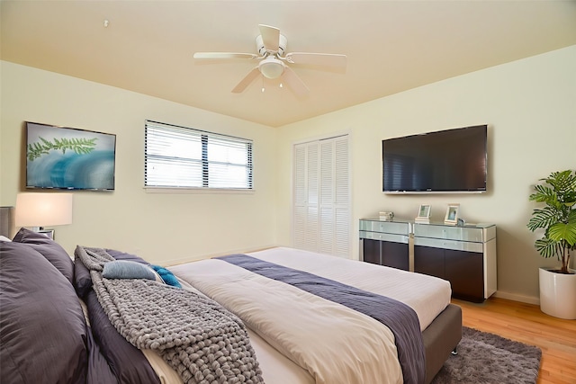 4114 Lemac Dr, Houston, TX 77025 - bedroom featuring light wood-style floors, ceiling fan, and a closet
