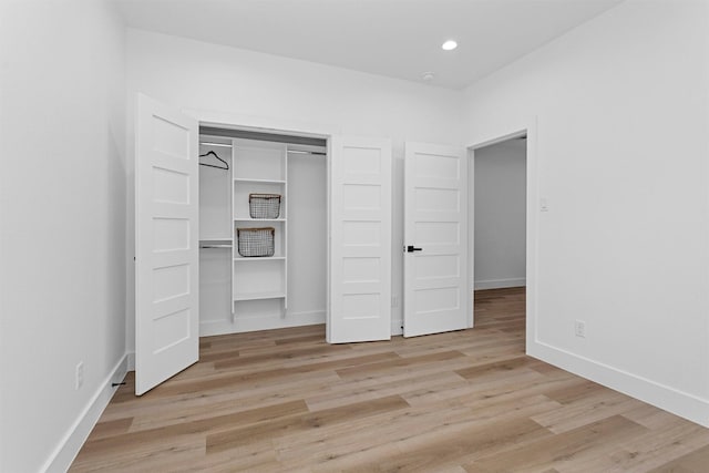 4021 King St, Houston, TX 77026 - unfurnished bedroom with light wood finished floors, a closet, and recessed lighting