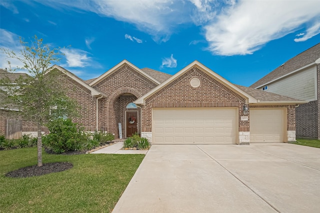 406 Riesling Dr, Alvin, TX 77511 - view of front of house featuring brick siding, an attached garage, concrete driveway, and a shingled roof