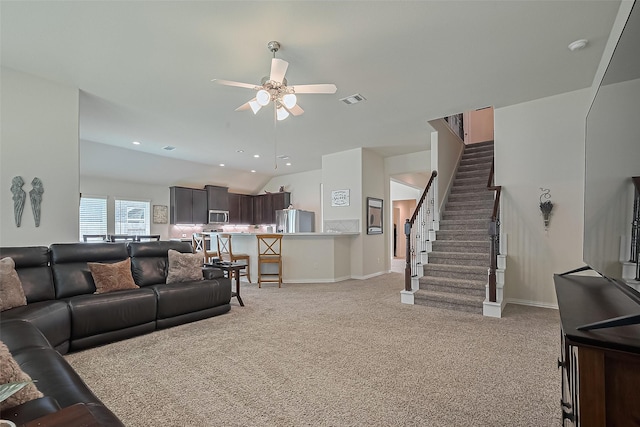 406 Riesling Dr, Alvin, TX 77511 - living area featuring lofted ceiling, light colored carpet, a ceiling fan, stairway, and recessed lighting