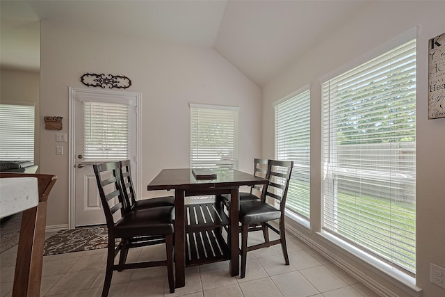 406 Riesling Dr, Alvin, TX 77511 - dining room with light tile patterned floors and vaulted ceiling