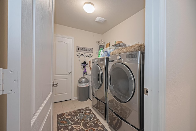406 Riesling Dr, Alvin, TX 77511 - laundry area featuring washer and dryer and light tile patterned floors